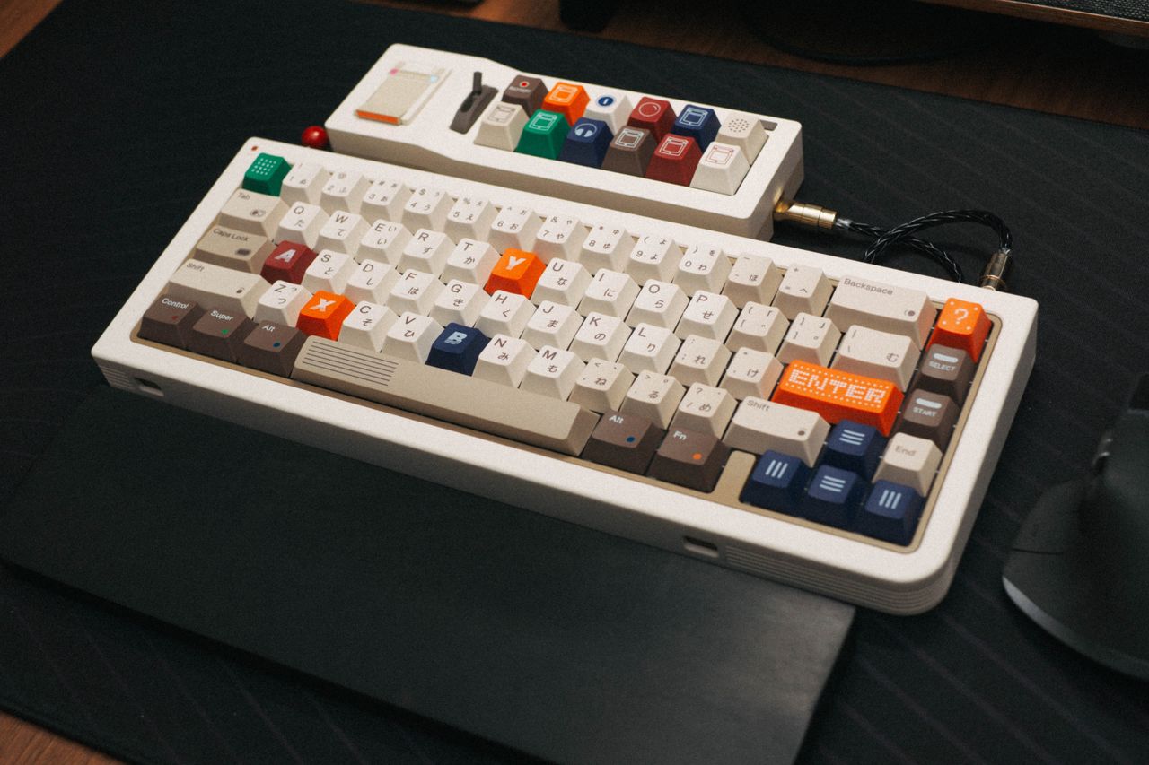 services-01 A vibrant mechanical keyboard with colorful keys on a desk, perfect for typing or gaming enthusiasts.